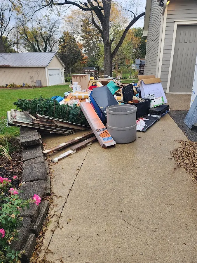Dumpster being loaded with debris for Commercial Dumpster Rental in North Richmond